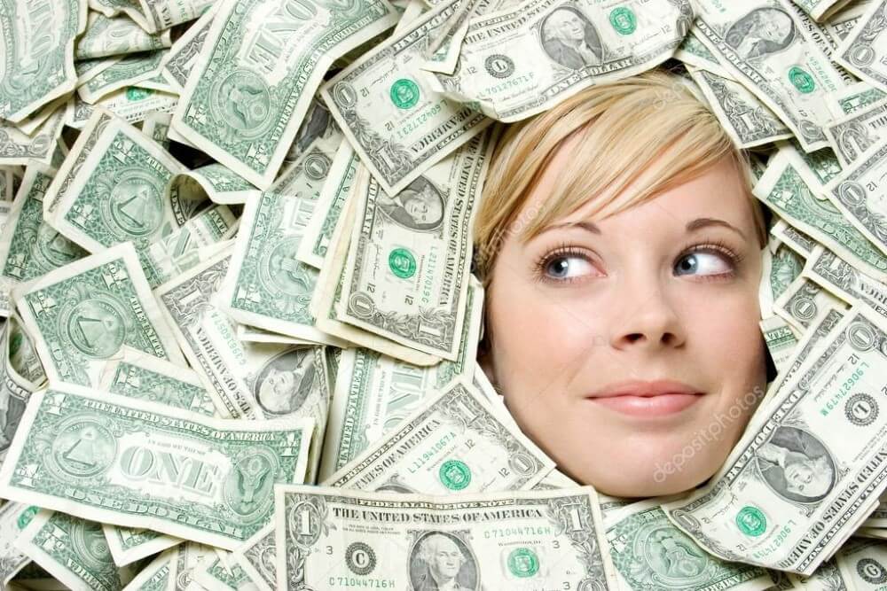 A woman in a pile of money